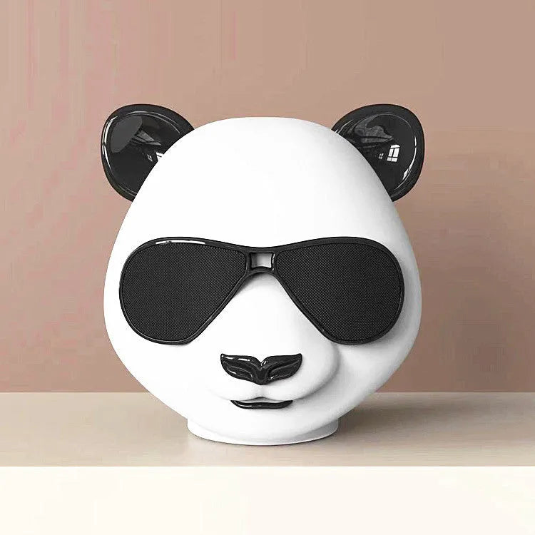 Compact classic style portable mini Bluetooth speaker shown on a surface.