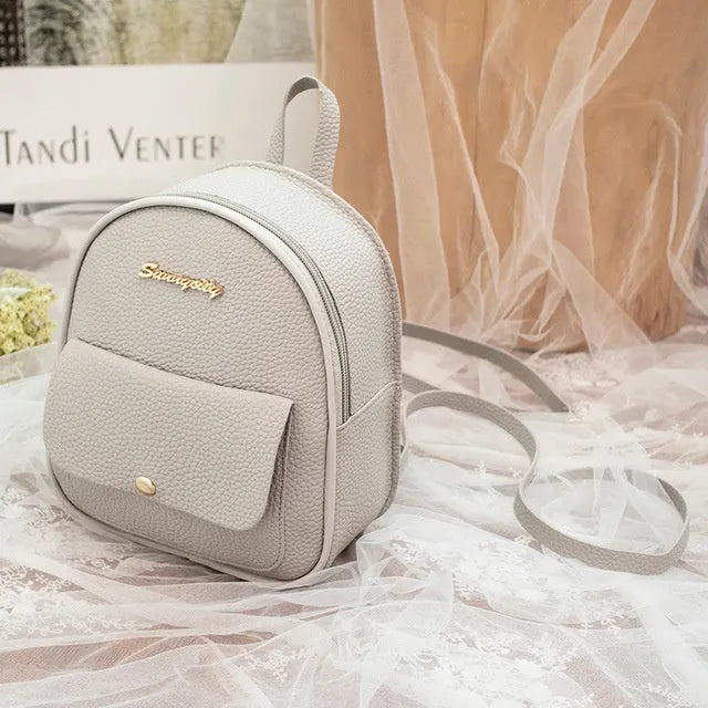 Women's black PU shoulder bag backpack compact letter purse with zipper closure