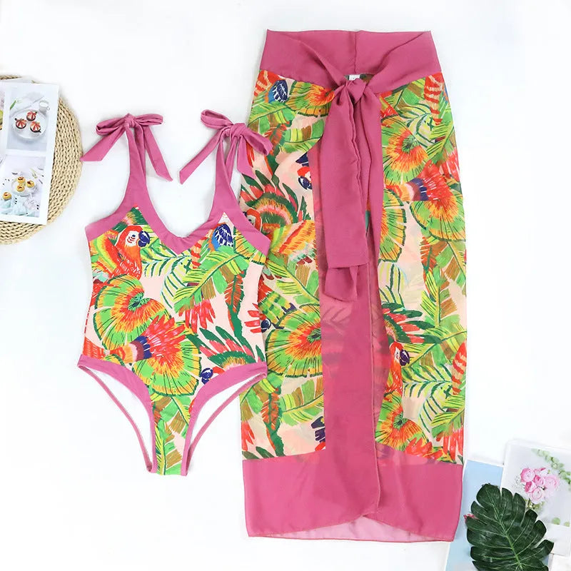 Pink floral print retro one-piece swimsuit with V-neck and thin skirt for women.