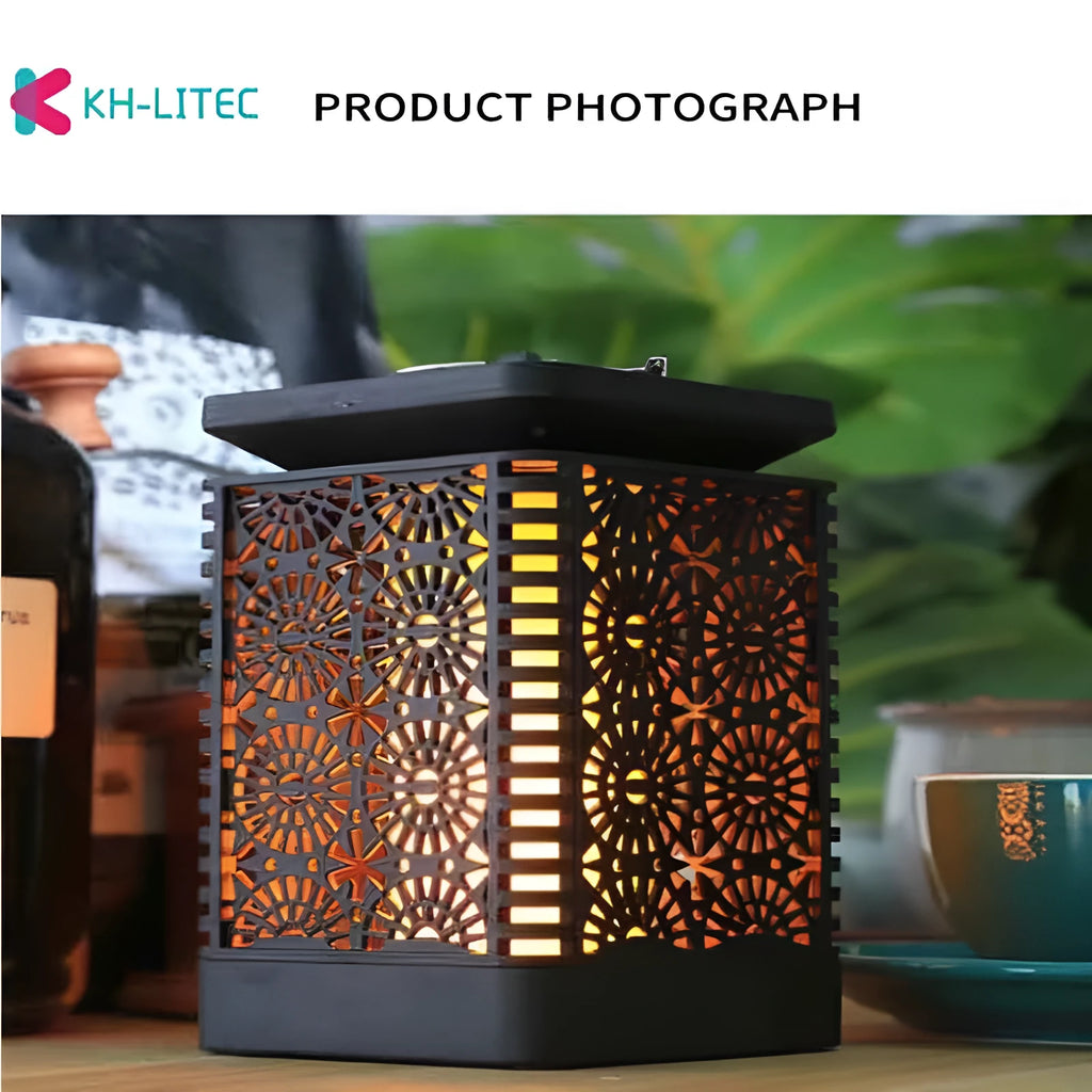Set of four black solar-powered flame torch lights with flickering LED effect for garden pathways