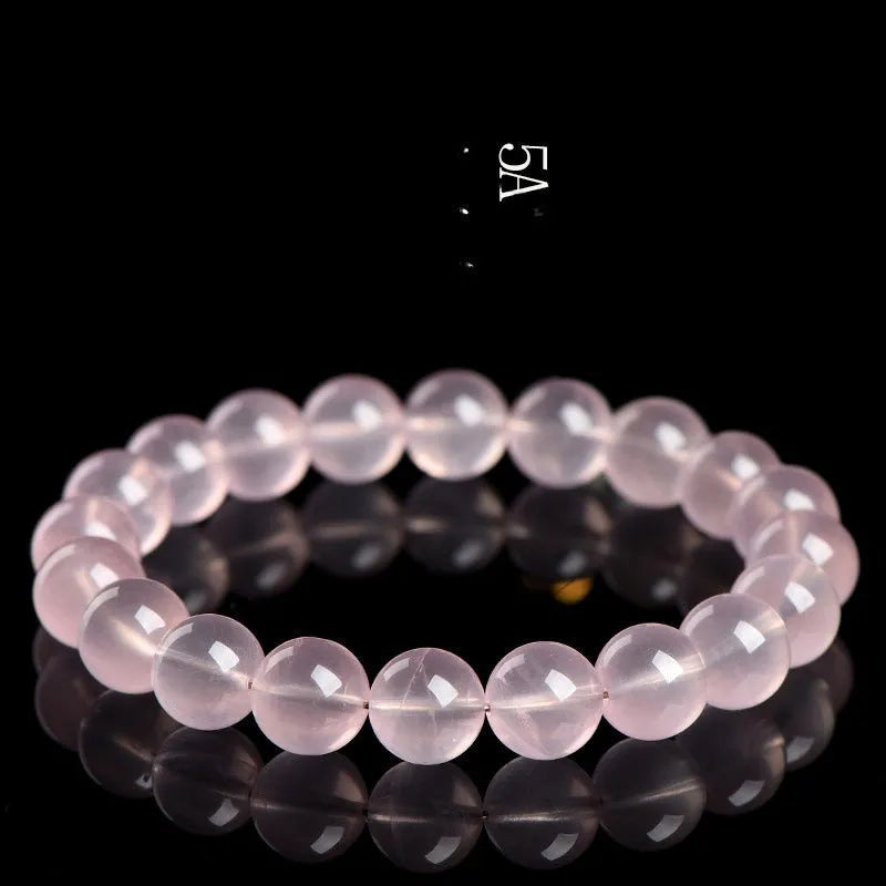 Women's polished crystal round bead bracelet in pink, showing single circle design with various size options.