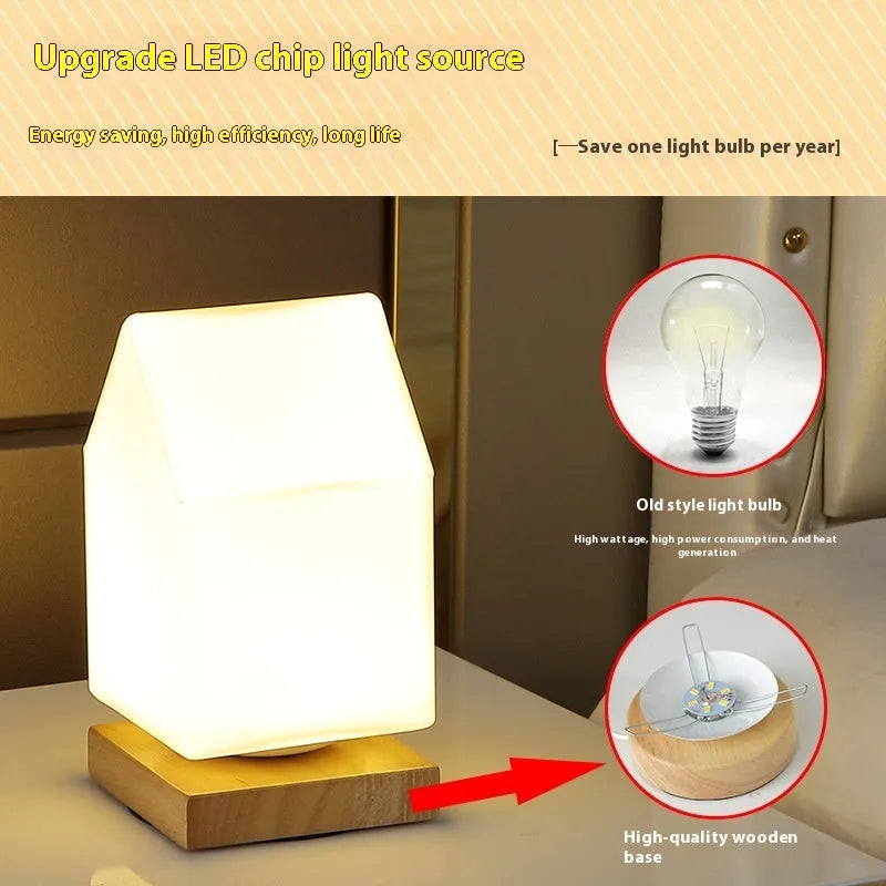 Nordic solid wood USB table lamp in a white geometric shape on a wooden surface.