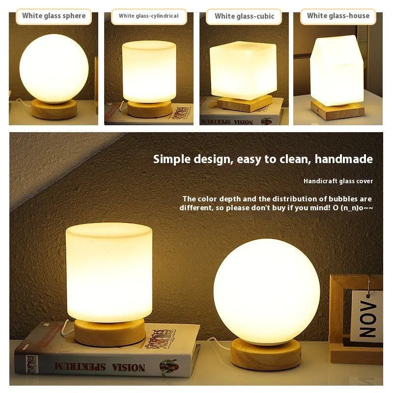 Nordic solid wood USB table lamp in a white geometric shape on a wooden surface.