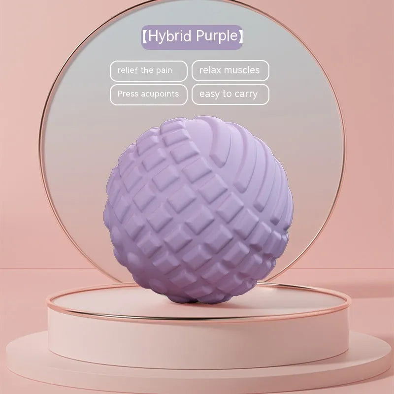 Blue TPR foot massage ball with spiky texture on wooden surface
