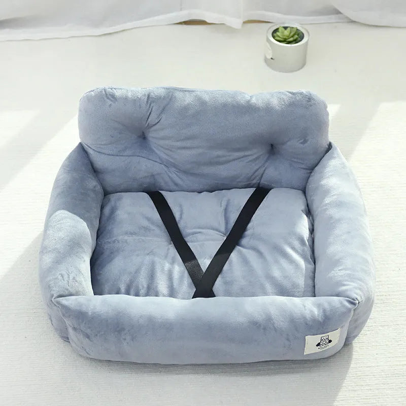 Blue plaid fabric car-mounted dog travel nest for small or medium dogs on a car seat