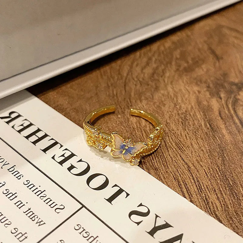 Creative Chinese butterfly women's copper ring with dripping oil treatment process in simple style.
