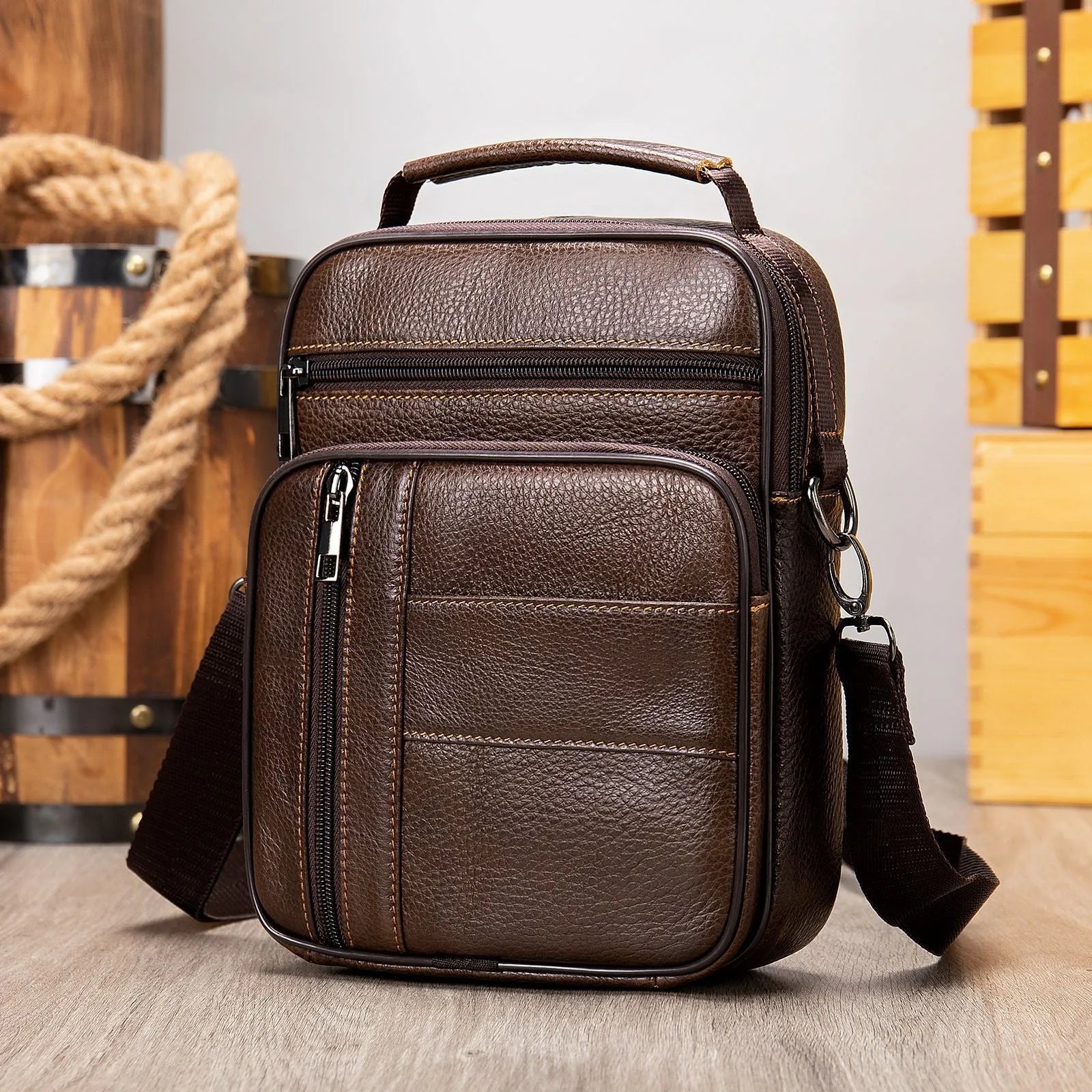 Genuine leather vintage men's shoulder bag in a vertical square shape, showing internal organiser pockets.