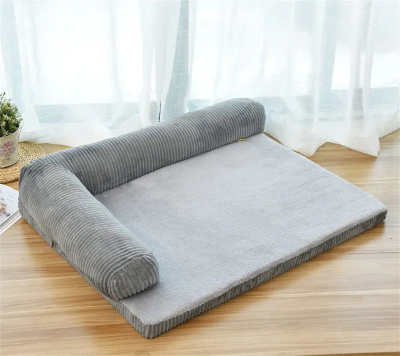 Corduroy pet sofa dog bed in grey colour with a non-slip base, shown in a bilateral style.