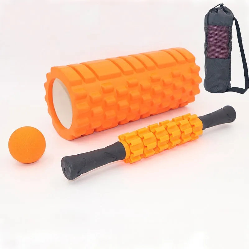 Black 33cm fitness foam roller with six gear massage bar pieces on grey background