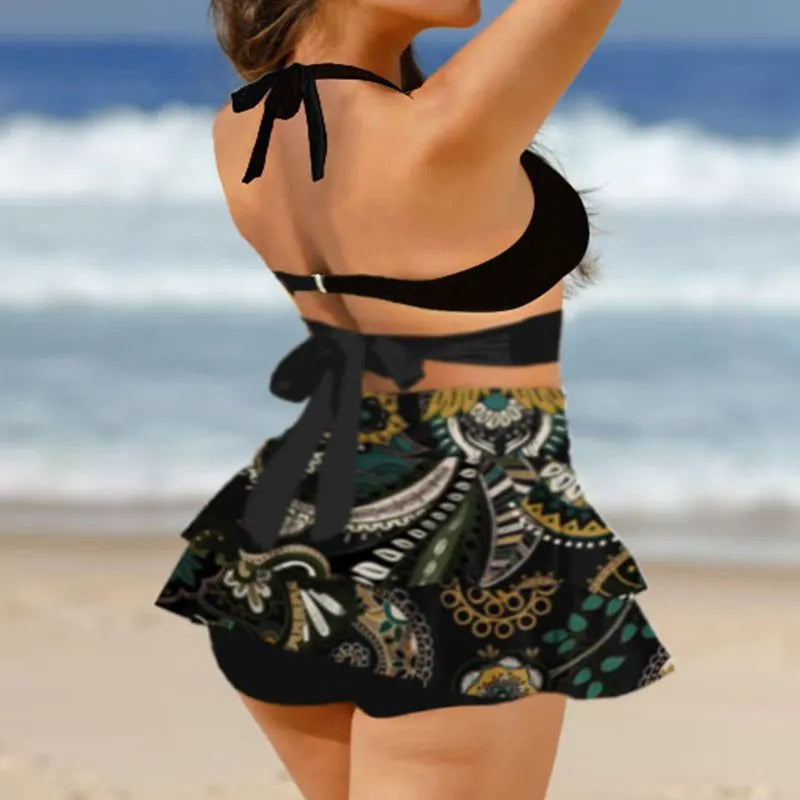Women's purple split swimsuit bikini set with matching skirt and lace-up detailing
