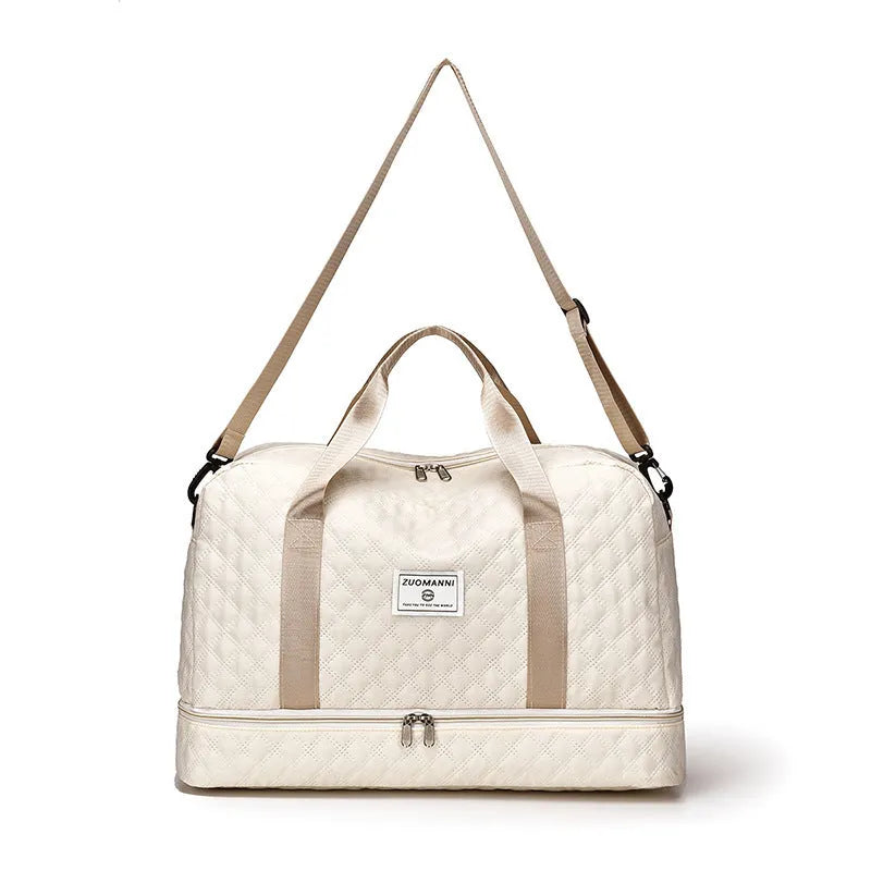 Oxford cloth travel bag with 36-55 litre capacity for leisure trips and buggy use in solid colour options