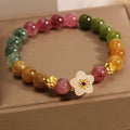 Natural colour tourmaline bracelet with electroplating in flower or fu character geometric design