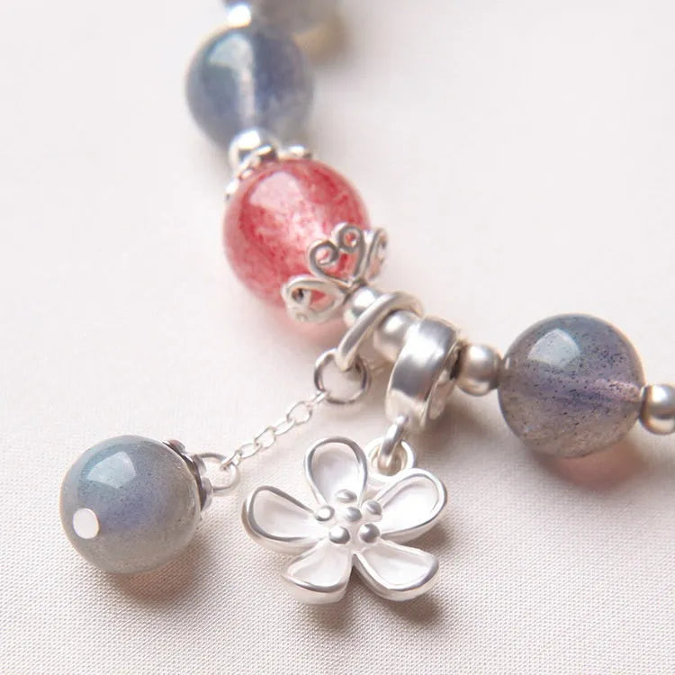 Women's silver bracelet with grey moonlight finish, 7.5mm lime and strawberry crystals, zodiac animal motif, and honeysuckle charm.