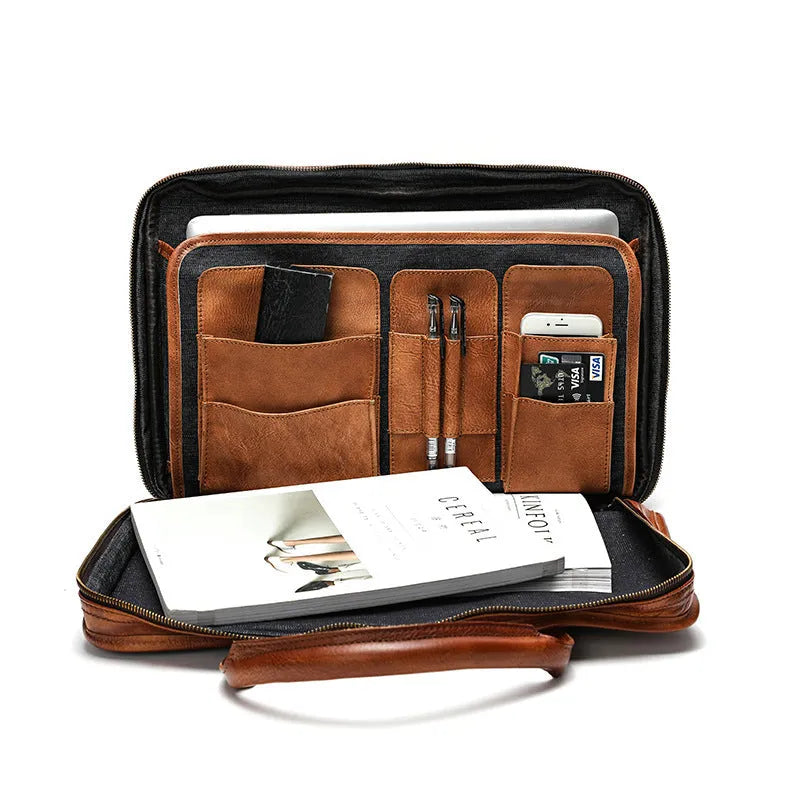 Large brown leather men's briefcase showing multiple internal compartments and organisation pockets