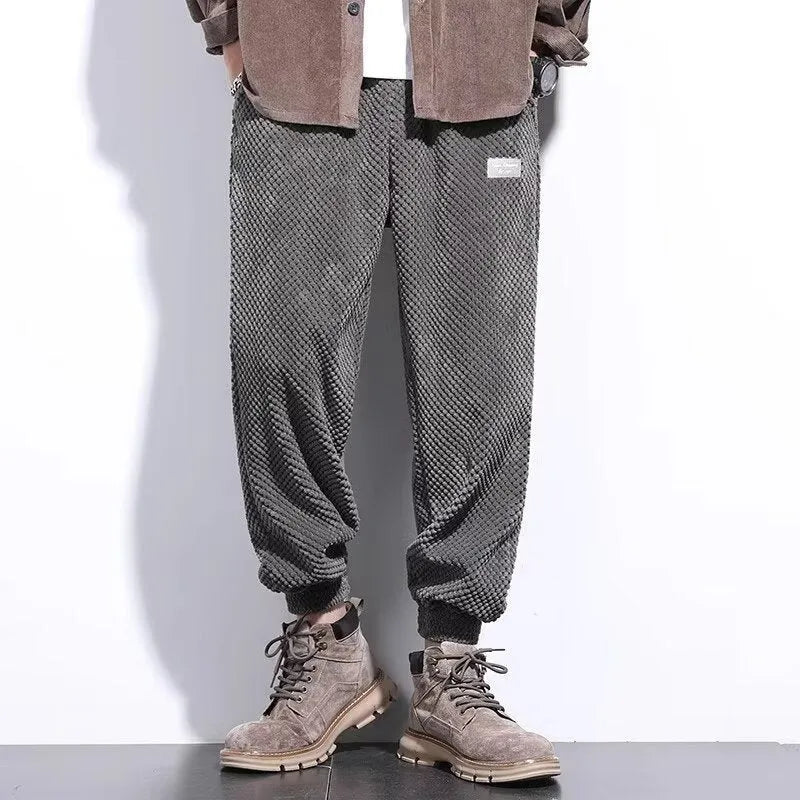 Men's grey straight leg sweatpants with an ankle-tie closure, laid flat.