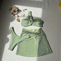 Three-piece one-shoulder swimsuit set in polyester with matching skirt