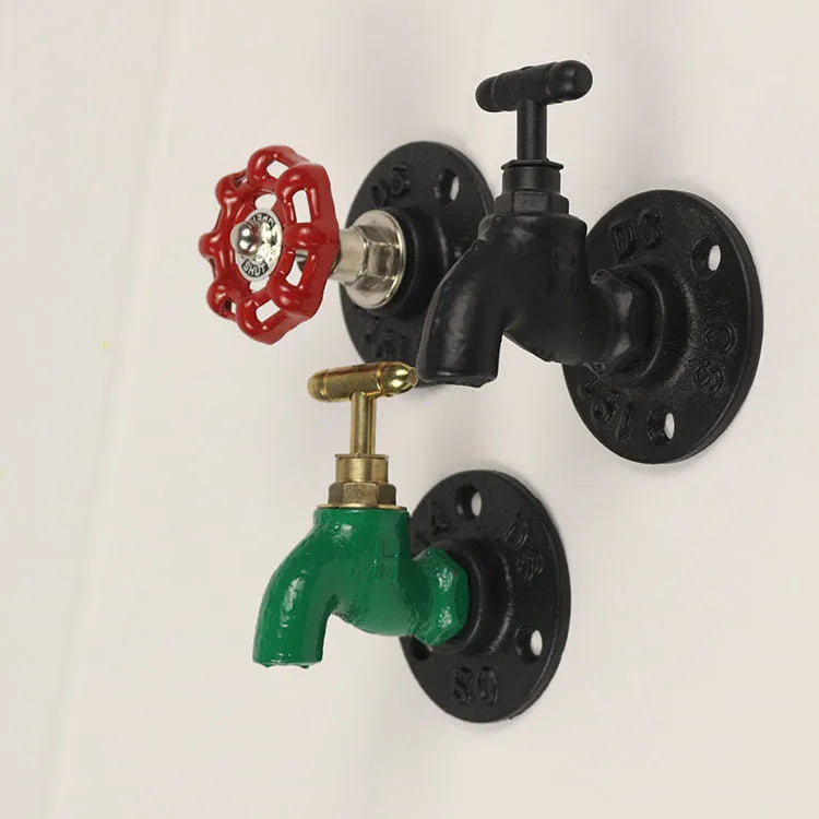 A polished metal wall hook in a water pipe design, shown in black, green, and red colour options.