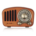 Retro wooden wireless mini speaker in cherry wood finish showing front grille and compact size