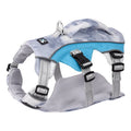 Reflective blue dog cooling vest chest strap harness with quick-release buckle on a grassy background.