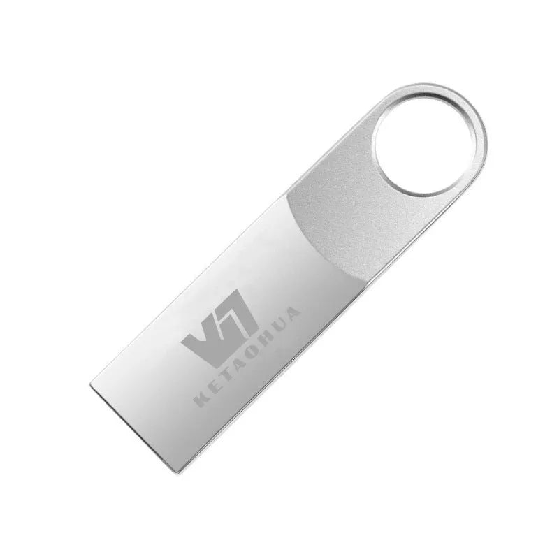 Silver metal car-shaped USB flash drive on a white background, showing USB connector.