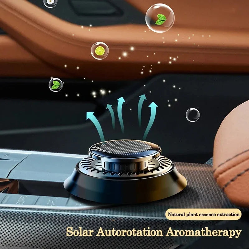 Solar kinetic car air freshener with rotating double rings on vehicle dashboard