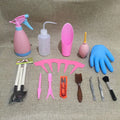 Succulent gardening tool set with plastic watering can, mini shovel, tweezers, and small brush arranged for indoor plant care