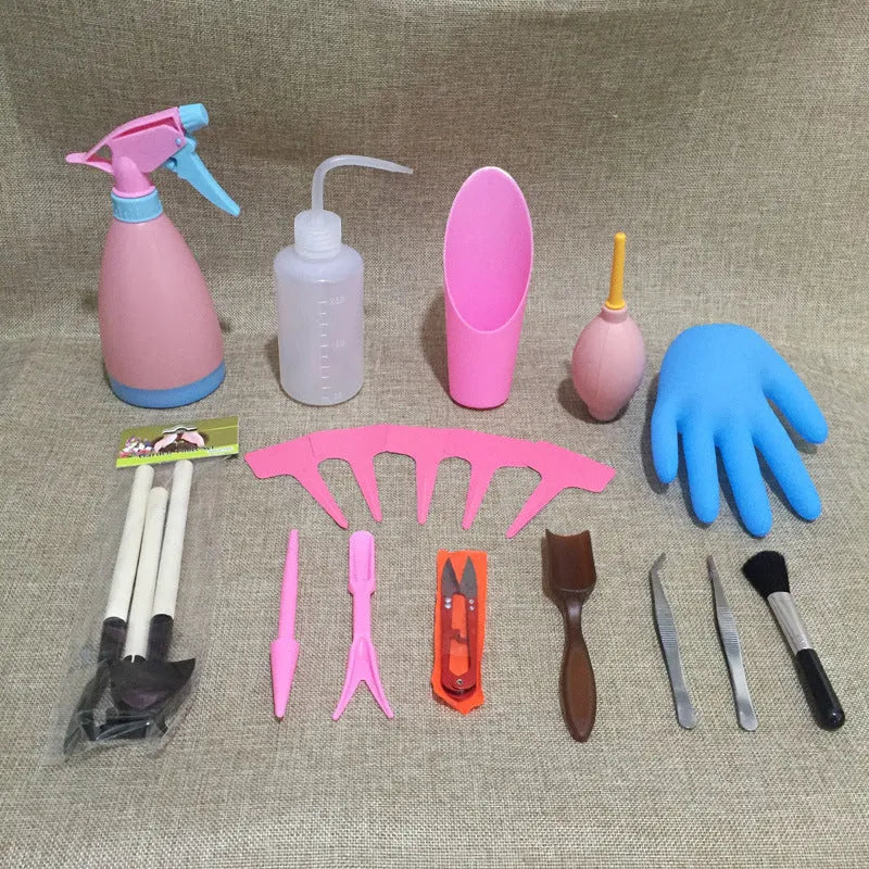 Succulent gardening tool set with plastic watering can, mini shovel, tweezers, and small brush arranged for indoor plant care