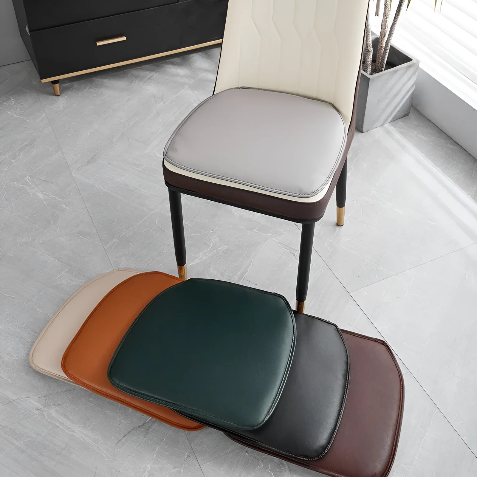 Beige leather horseshoe-shaped seat cushion on an office chair, showing non-slip base.