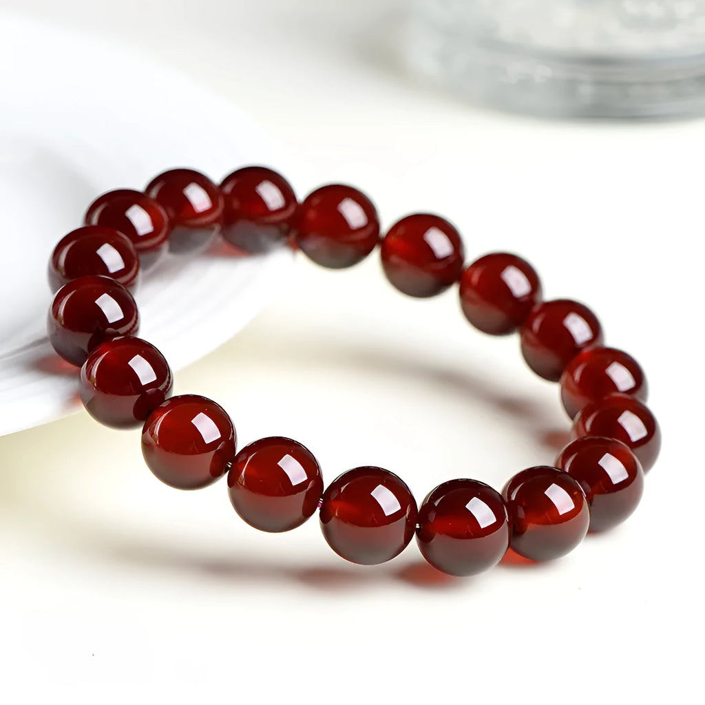 Natural orange red garnet crystal ball bracelet with Ruyi symbols in retro unisex design