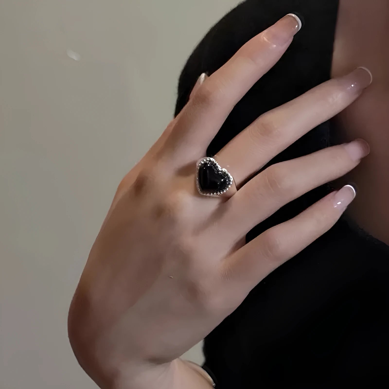 Adjustable sterling silver ring with heart-shaped black agate centrepiece showing open mouth design