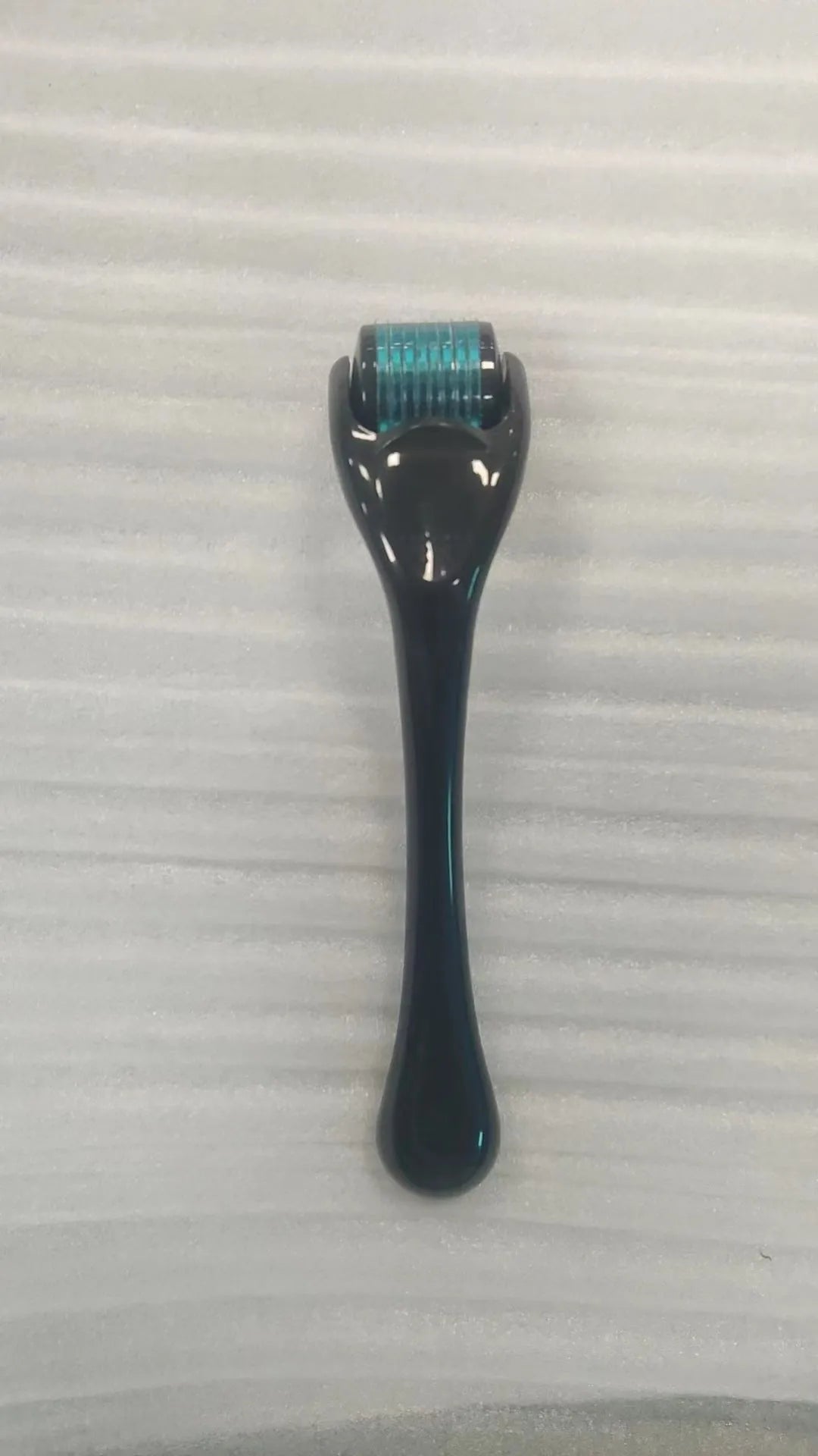 540 micro needle derma roller showing handle and needle wheel in a selected colour