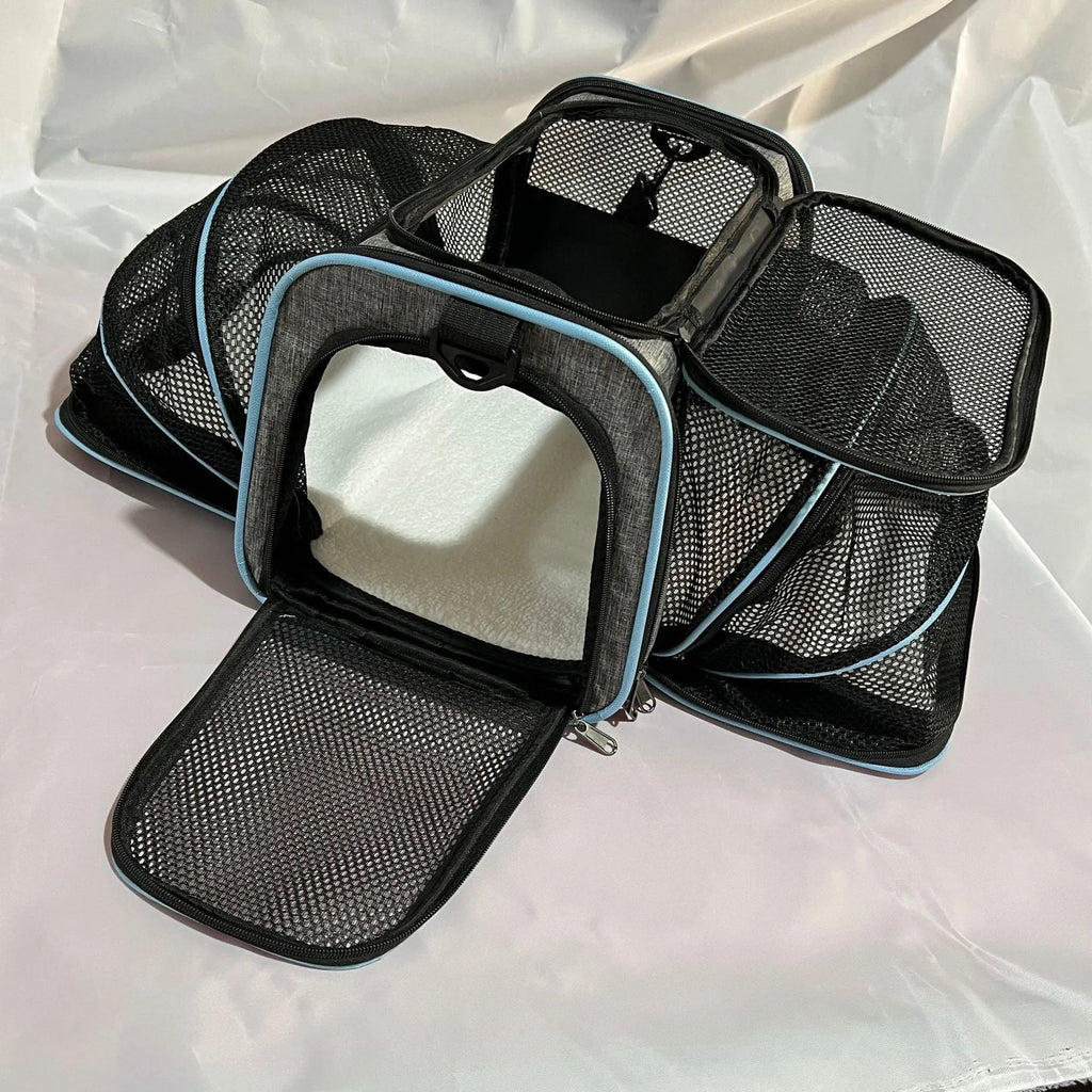 Cat carrier bag in black with red piping made from 600D cation fabric showing portable design