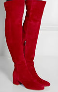 Women's grey suede over the knee flat boots with a pointed toe and low thick rubber sole.