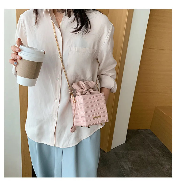 Women's small bucket messenger bag with detachable chain strap in multiple colour options