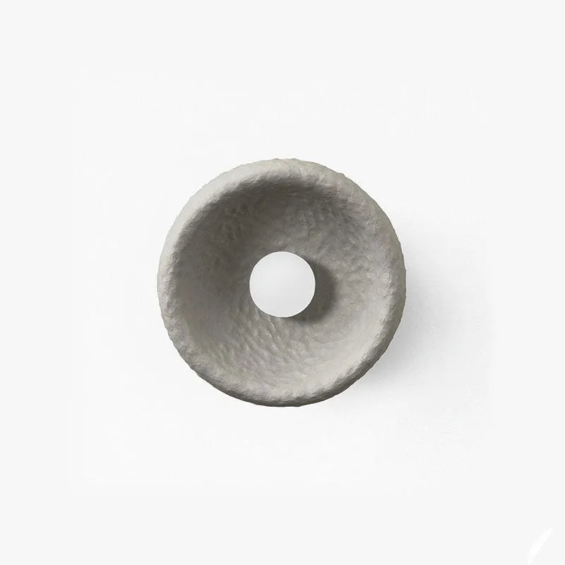 Japanese-style wall lamp with resin shade in three diameter sizes on white wall