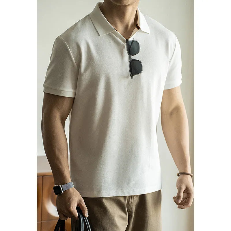Man's blue American-style short-sleeved cotton blend polo shirt on a hanger.