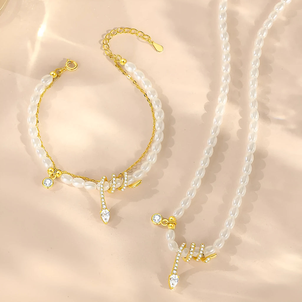 Pearl snake bracelet in 925 silver with electroplated gold or white gold colour on a wrist.