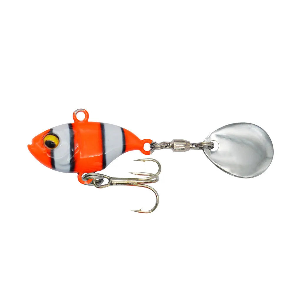 Metal sea fishing lure with rotating sequins in gold colour pattern