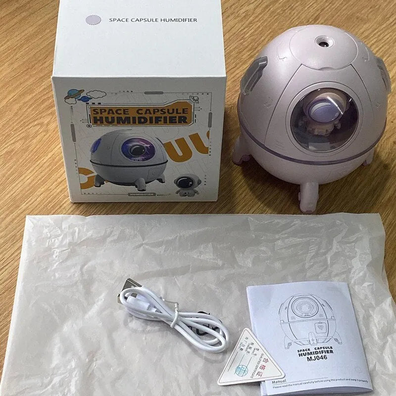 Purple astronaut shaped desktop humidifier with 220ml tank and USB cable