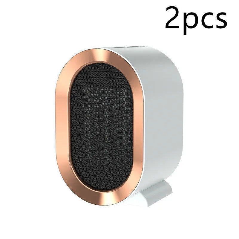 Desktop ceramic fan heater in black with mechanical control knobs and a front grille.
