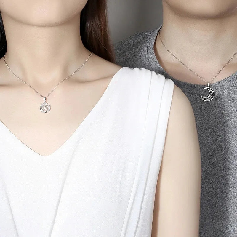 Sun and moon tooth couple necklace with copper pendant and cross chain.
