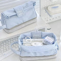 Folding double-layer polyester pencil case in dark blue, blue, and cream white colour options