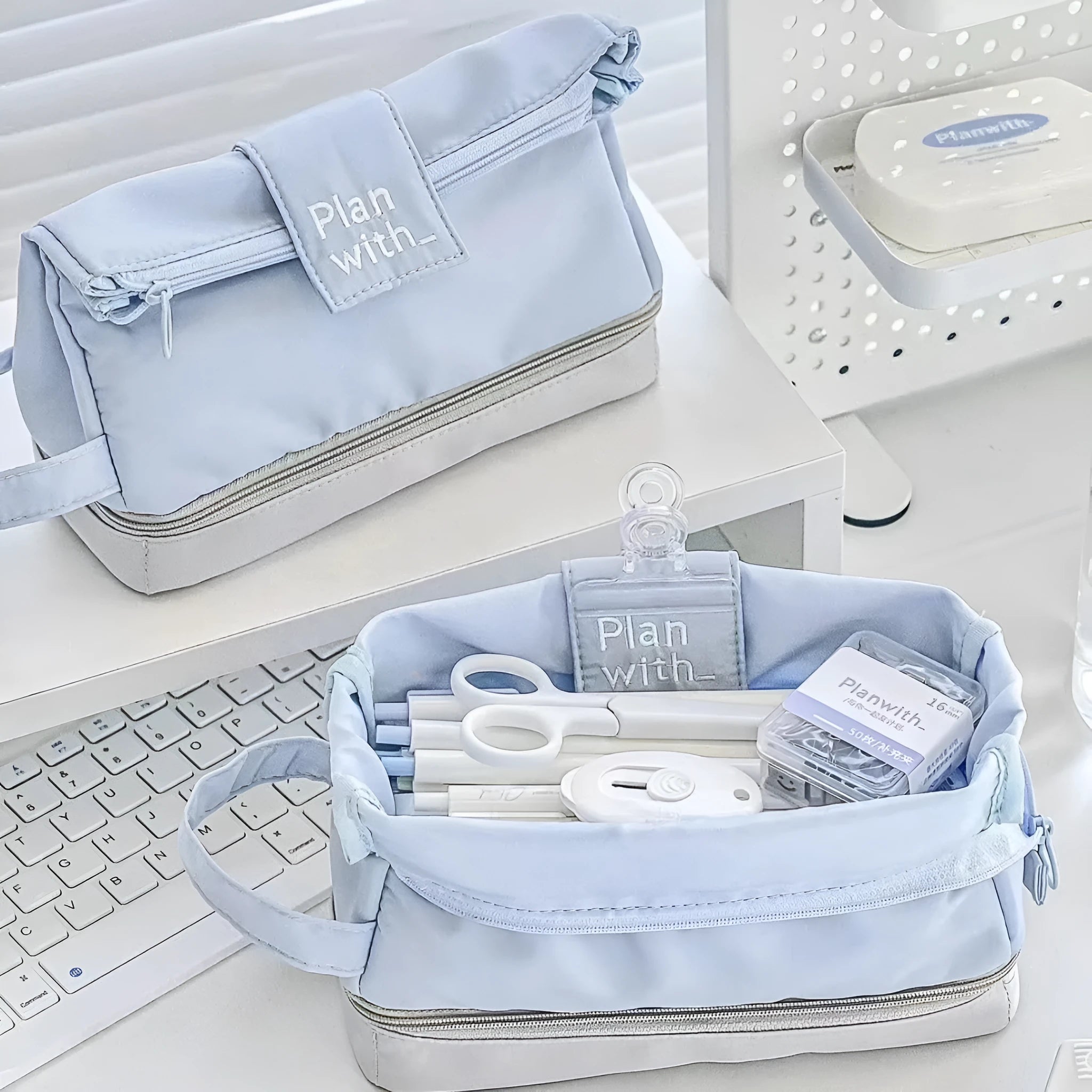 Folding double-layer polyester pencil case in dark blue, blue, and cream white colour options