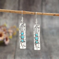 Silver geometric earrings with long strip design and turquoise inlay details