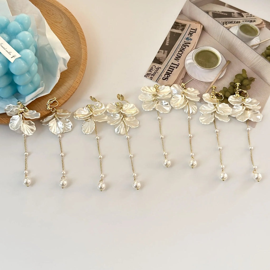 Women's acrylic shell pearl tassel earrings showing length, with a choice of four ear clip types.