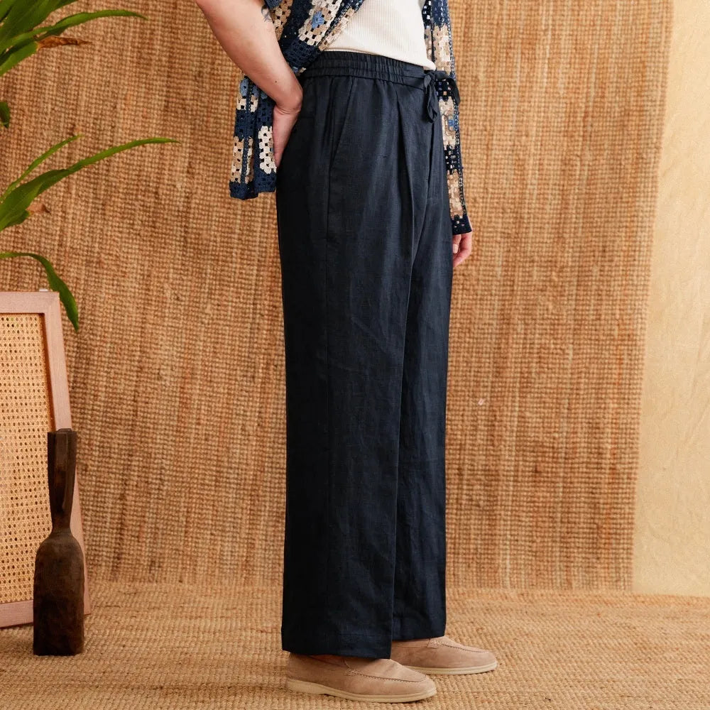 Women's linen high-waist trousers with elasticated waistband in navy blue, white, and greige colours
