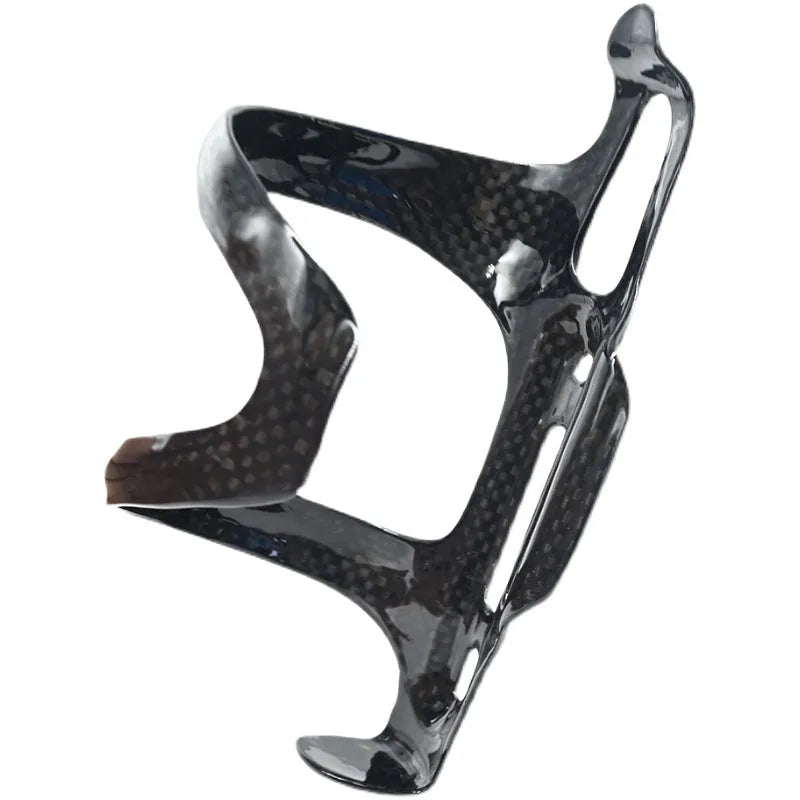 Black carbon fibre side pull bicycle water bottle cage showing mounting holes and bottle retention shape