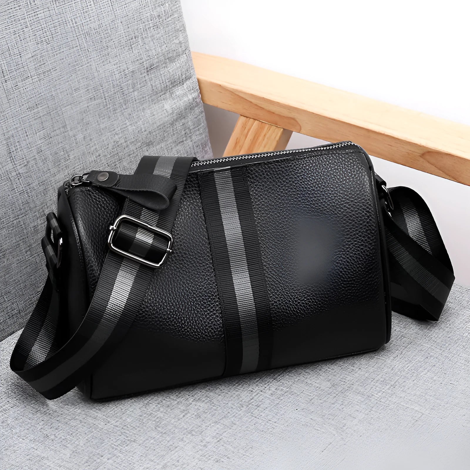 Black genuine leather one-shoulder crossbody bag showing front view and size.