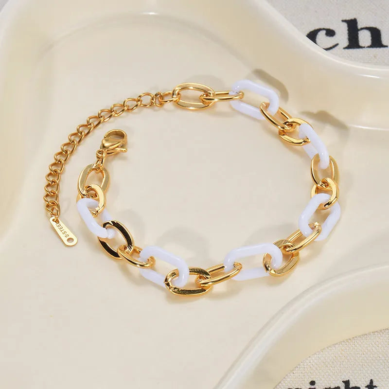 Women's stainless steel bracelet with a double-layered resin heart shape and electroplated finish.