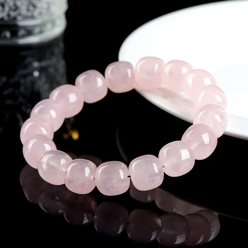 Pink natural crystal barrel bead bracelet with geometric 11mm x 12mm beads.